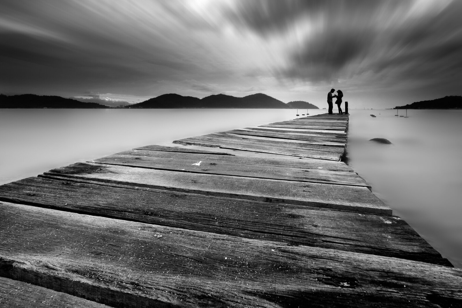 Couple on a bridge symbolizing unconscious relationship patterns and shifting perspective in intimate relationships
